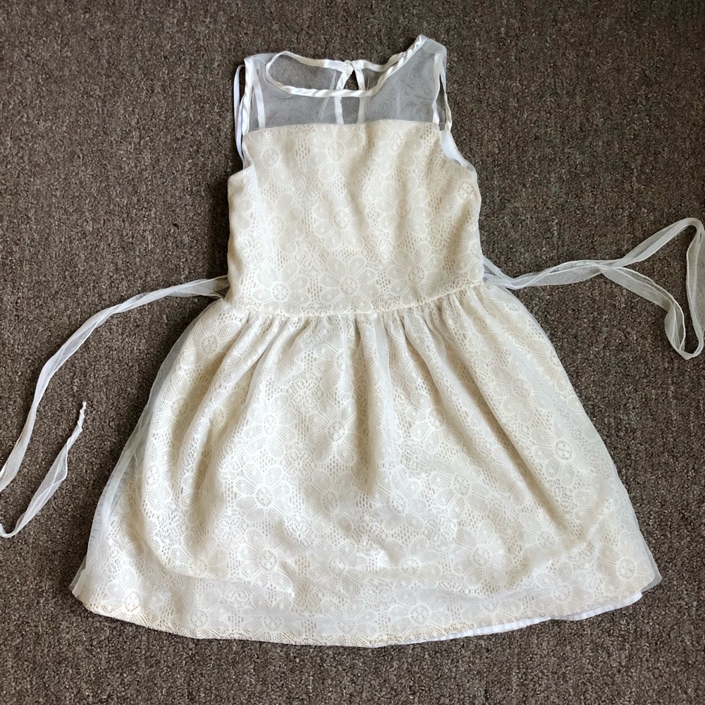 White/cream color lacy girls dress. Worn only 1-2x